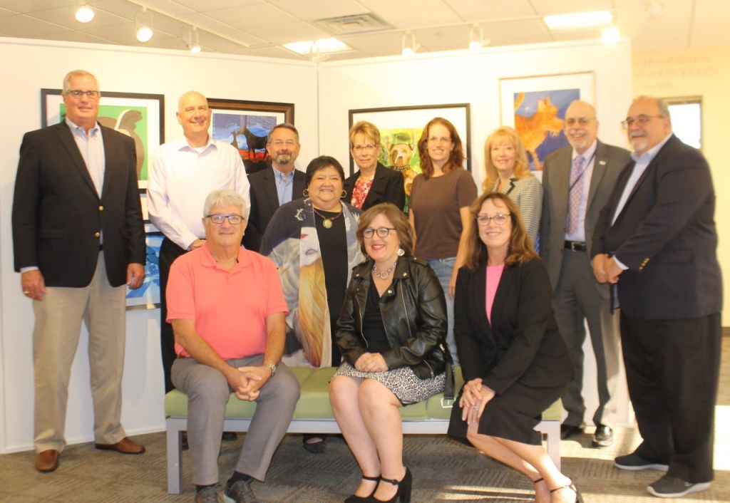 Photo shows a past Living Resources Corporation Governance Group. All 12 group members are facing the camera and smiling.