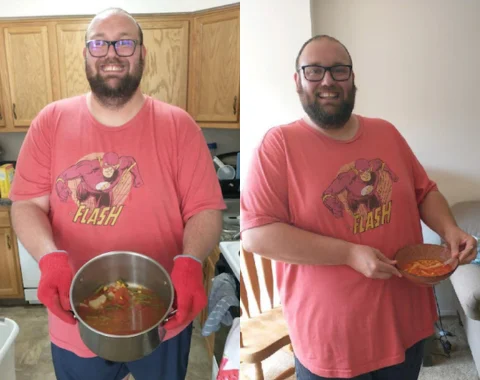 A man holds the food he prepared and smiles for the camera.