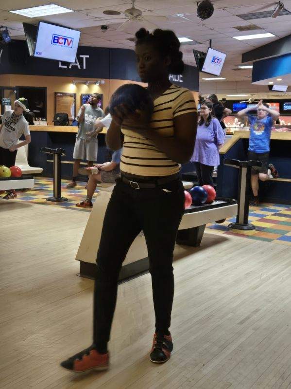 image000000 A young girl bowls at their end of the year party.