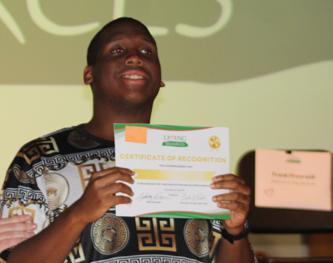 Day Services Awards 2 A man proudly stands and smiles for the camera with his award from living resources day services awards.