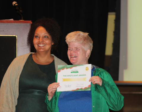 Day Services Awards 4 An art student stands with her instructor and smiles for the camera with her day services award.
